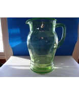 Vaseline glass pitcher in the rib optic pattern. - $25.00