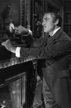 Errol Flynn in That Forsyte Woman Adjusting time on Clock 24x18 Poster - $23.99