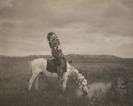 Oglala warrior Red Hawk sits on a horse in the Badlands South Dakota Photo Print - $7.49+
