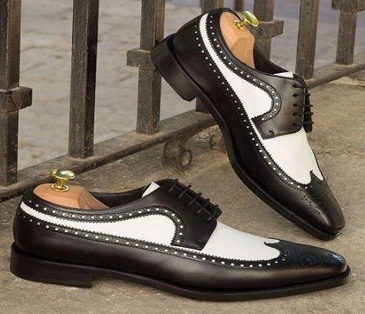 black and white wing tip shoes