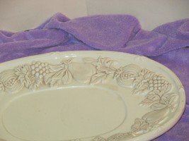 oval cream colored PLATE w/1.5" rim of raised fruits G GIBSON USA ELITE (hall G) - $5.94