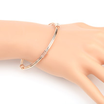 Rose Gold Tone Bangle Bracelet With Contemporary Design - $22.99
