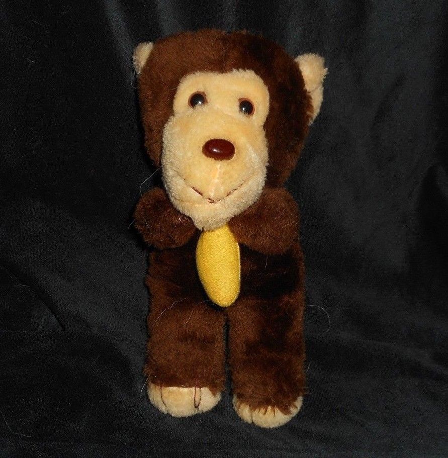 vintage stuffed monkey holding banana