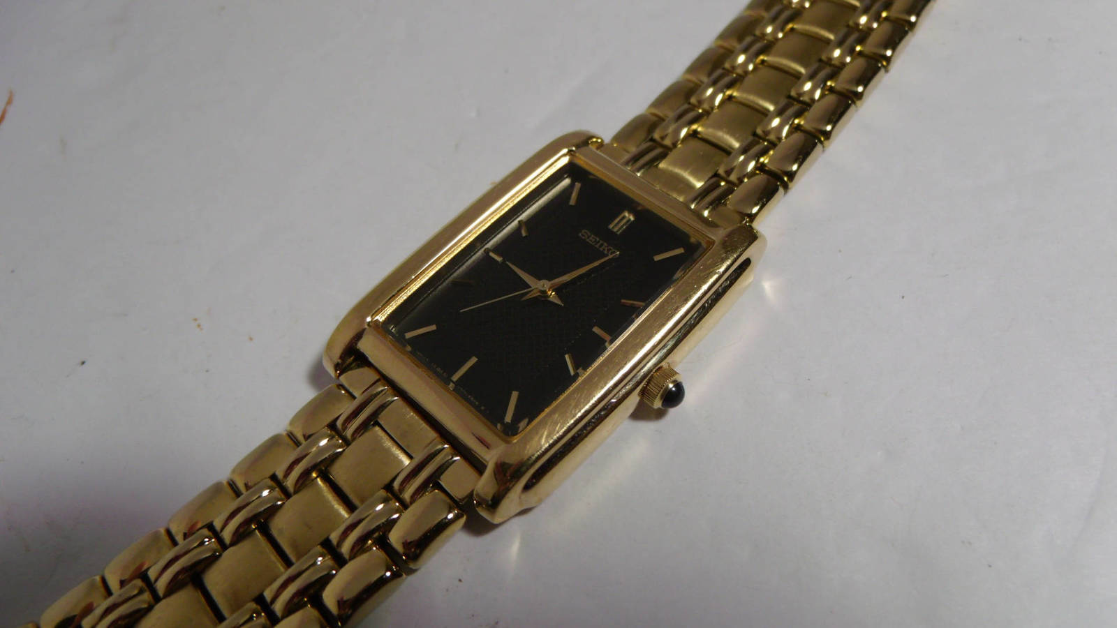 seiko gold watch with black face