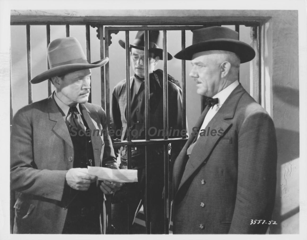 John Wayne Looks from Behind Bars 8x10 Photo - Black & White