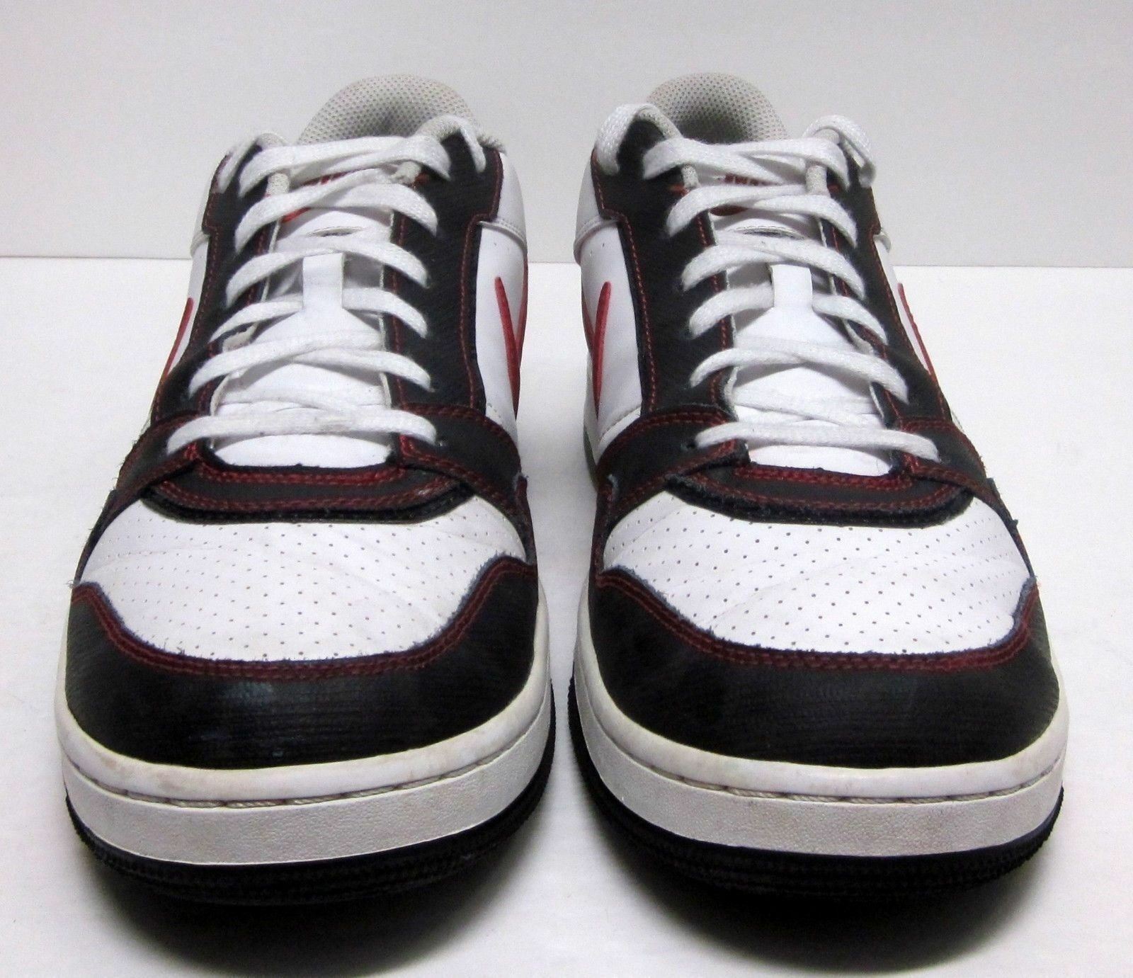 white nikes with red and blue swoosh