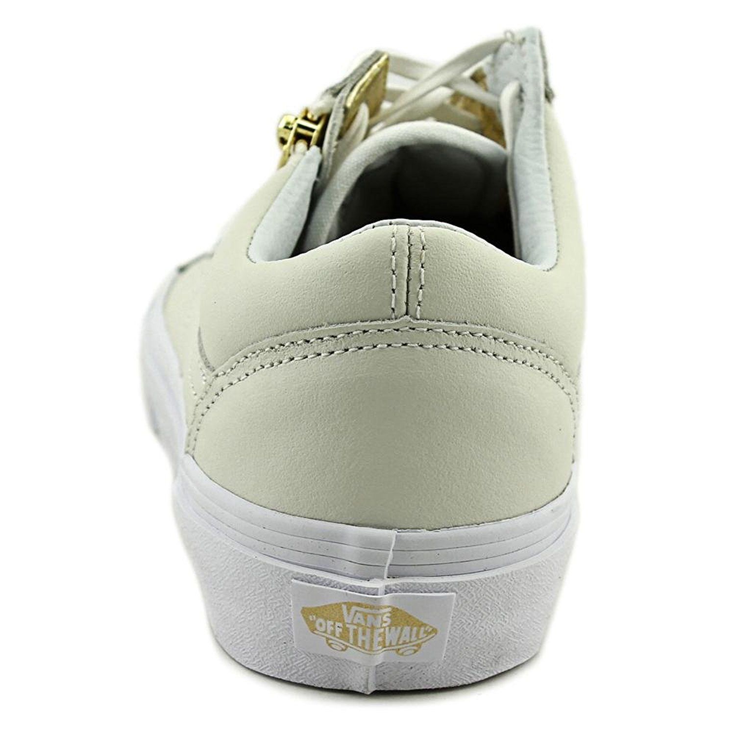 white and gold vans