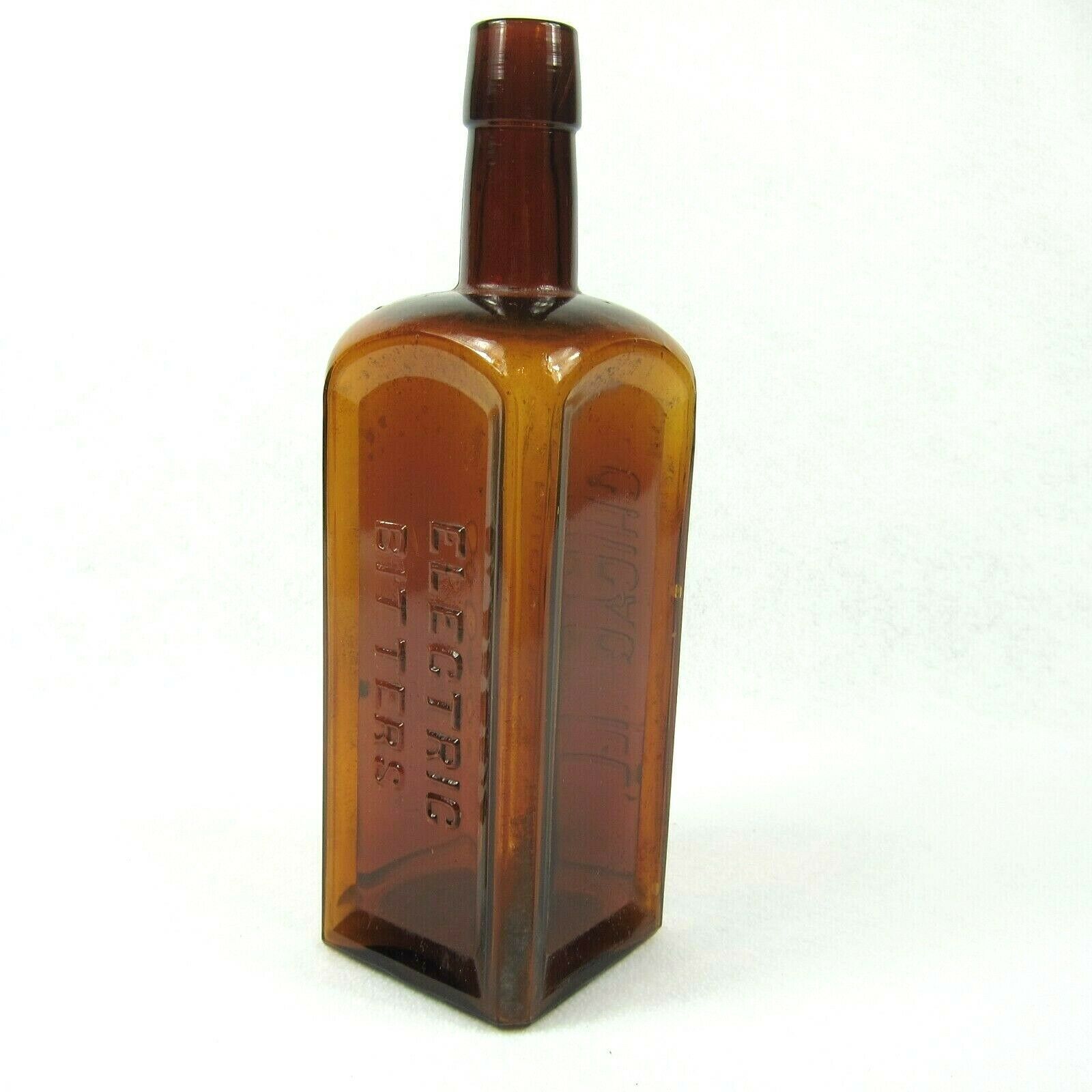 Antique 1800s Electric Bitters Glass Bottle Puce Amber Handtooled