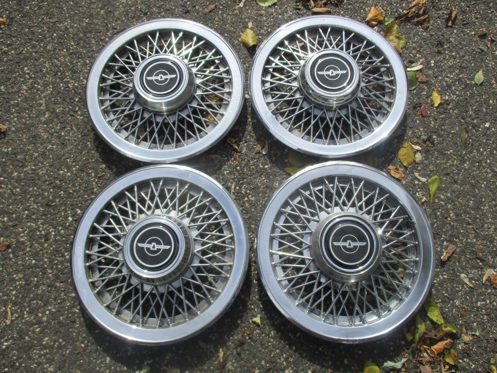 Lot of 4 1980 to 1988 Ford Thunderbird 14 inch wire spoke hubcaps wheel