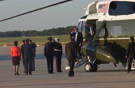 President George W. Bush salutes departing Marine One helicopter Photo Print - $7.49+