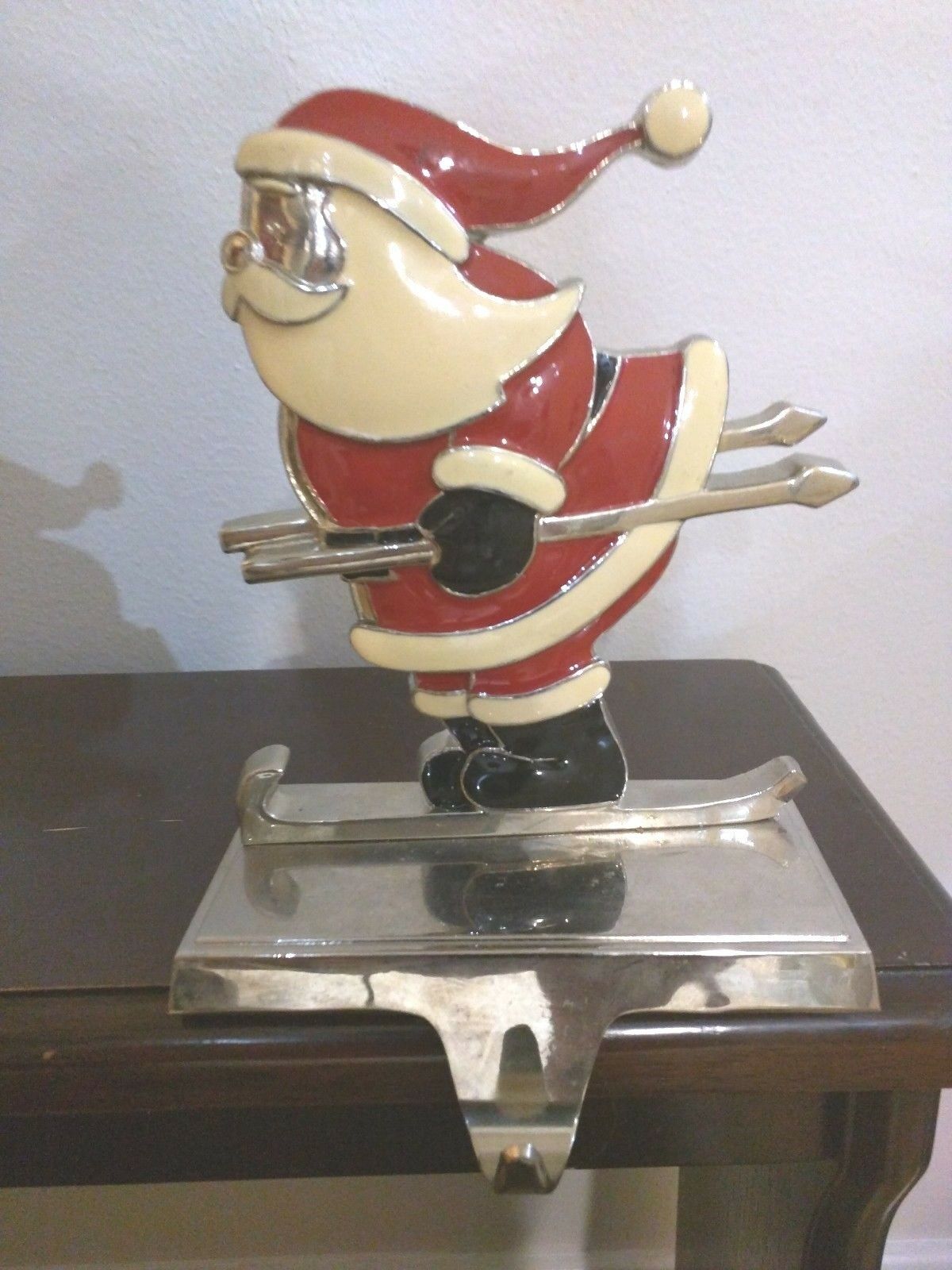 VINTAGE CAST IRON CHROME SANTA CLAUS ON SKII CHRISTMAS STOCKING HANGERS