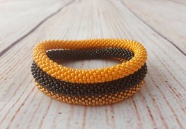 Nepal beaded rope bracelet set roll on bangle bronze gold orange birthda... - $18.00