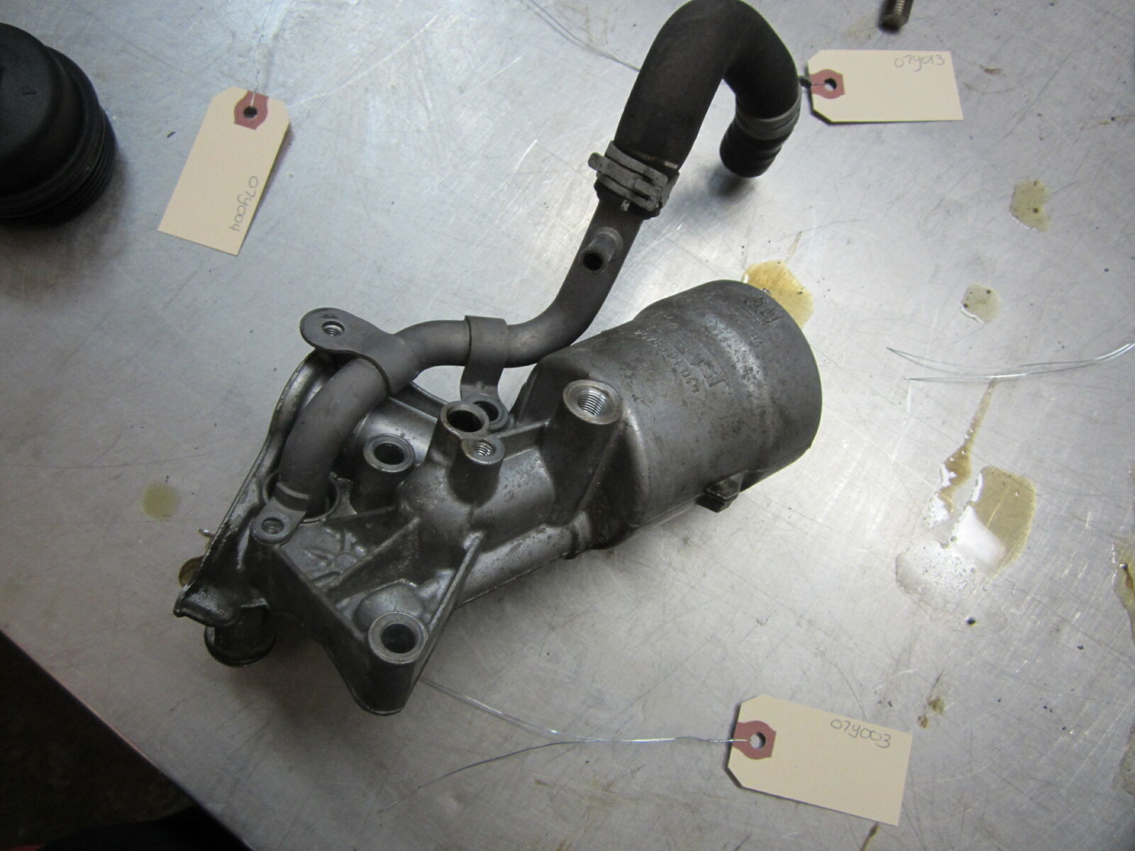 07Y003 ENGINE OIL FILTER HOUSING 2015 Chevrolet Trax 1.4 55566784