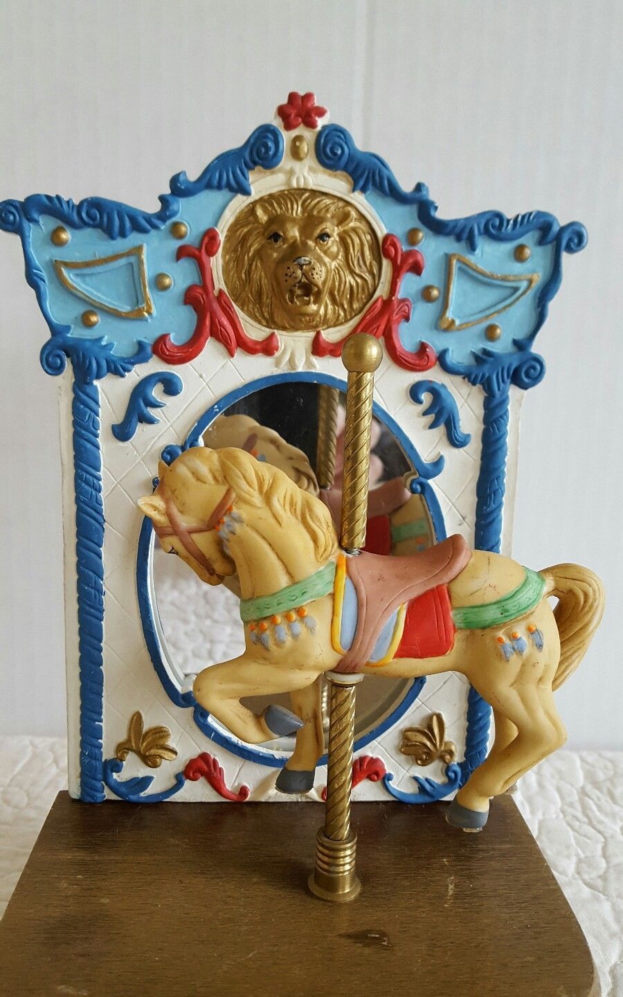 porcelain doll on carousel horse