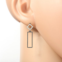 Silver Tone Drop Earrings with Dangling Cut-Out Geometric Accent - $22.99