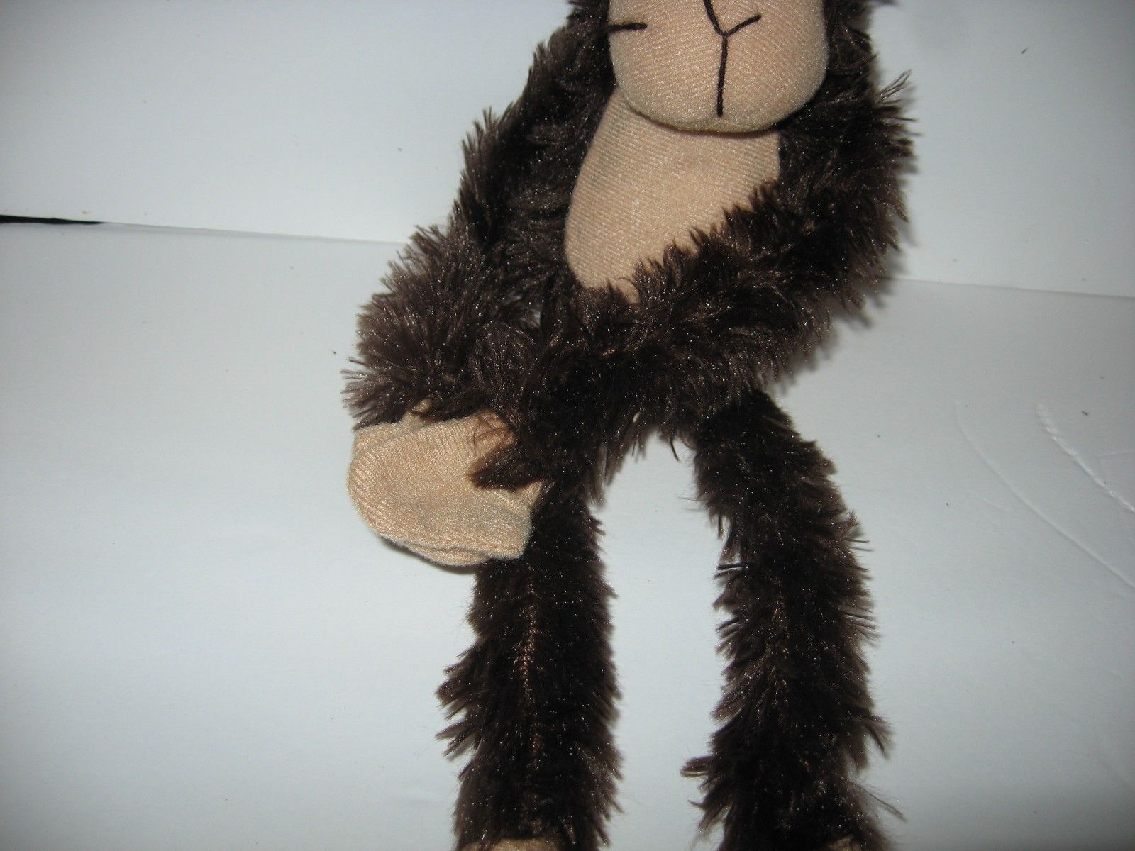 toy monkey with long arms and legs