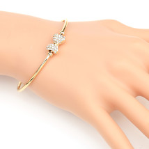Gold Tone Bangle Bracelet With Swarovski Style Crystal Bow - $27.99