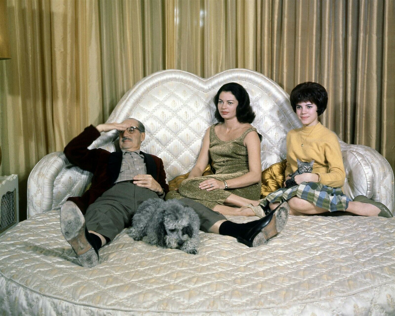 Groucho Marx poses on his bed with wife Eden and similar items