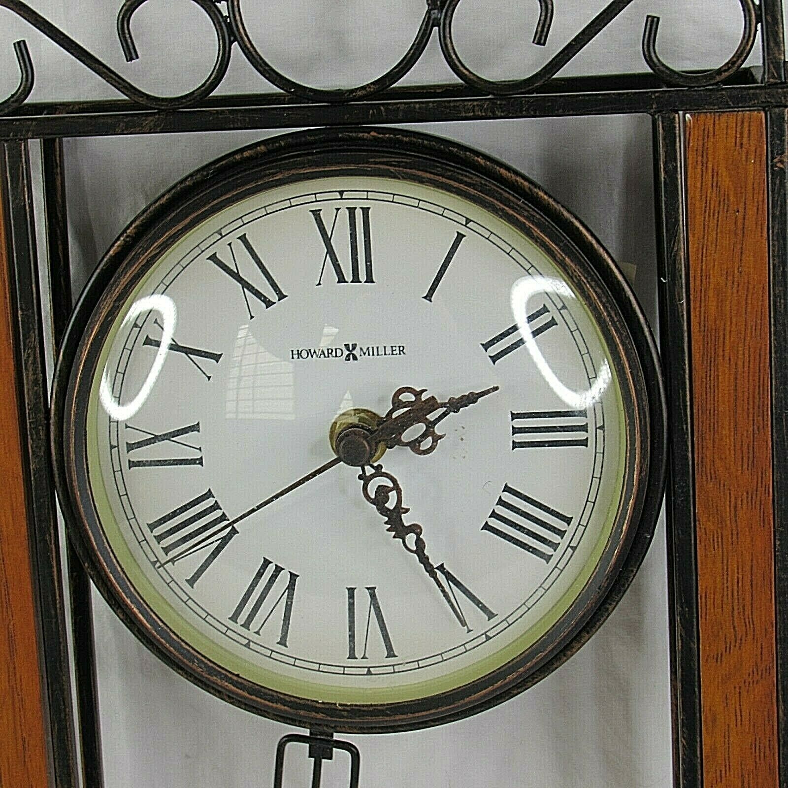 Howard Miller Wall Clock Antique Bronzed Wrought Iron Oak Wood Pendulum