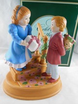 Vintage Avon Christmas Memories Porcelain Figurine Celebrating the Joy of Giving - $18.70