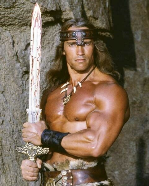 Arnold Schwarzenegger classic beefcake with sword as Conan The Barbarian poster
