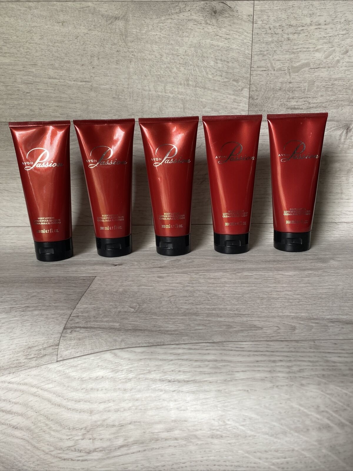 Primary image for Large Lot Of 5 Avon Passion Body Lotion 6.7 oz New Sealed