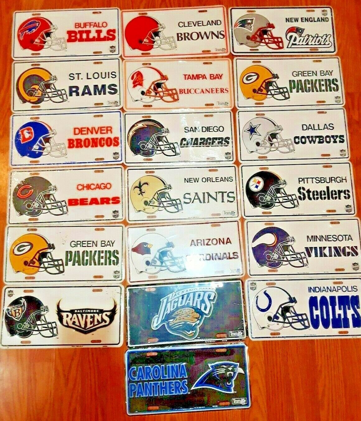 Primary image for Lot Of 19 FOOTBALL NFL metal License Plates All Different New sealed