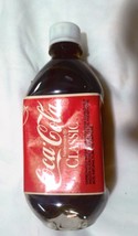 Coca Cola Classic   16 fl oz plastic bottle  full  with circle bottom - $8.42