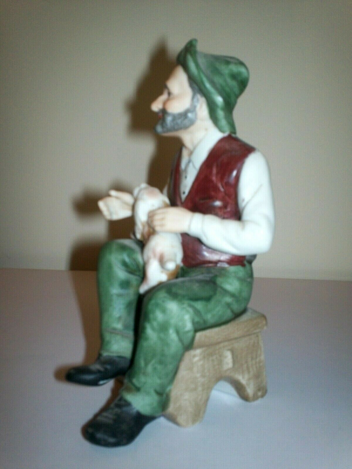 man and dog figurine