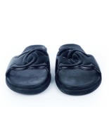 Black Chanel slippers with CC logo - $975.00