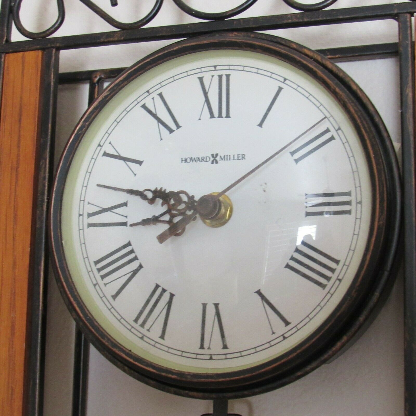 Howard Miller Wall Clock Antique Bronzed Wrought Iron Oak Wood Pendulum