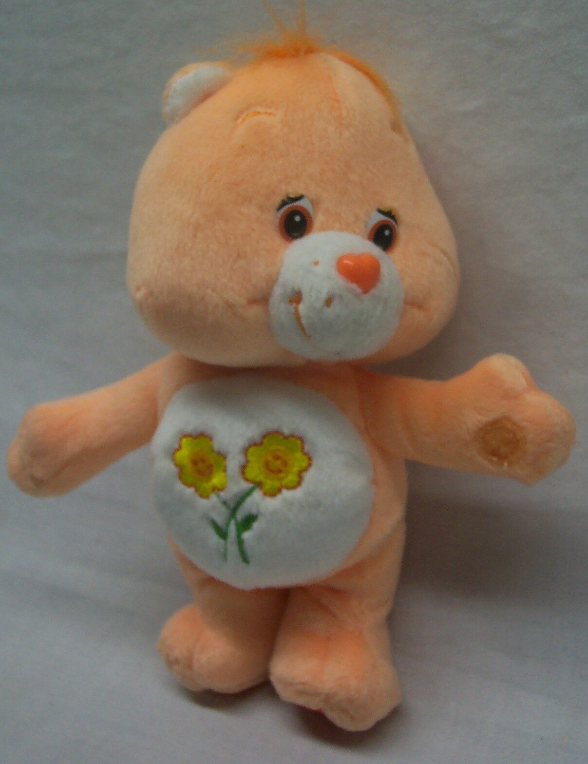 care bear orange with flowers