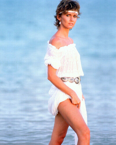 OLIVIA NEWTON-JOHN 1980's pose in white dress wading in surf 8x10 inch photo