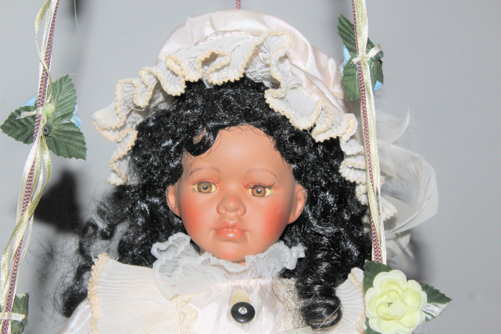 cathay collection porcelain doll on swing