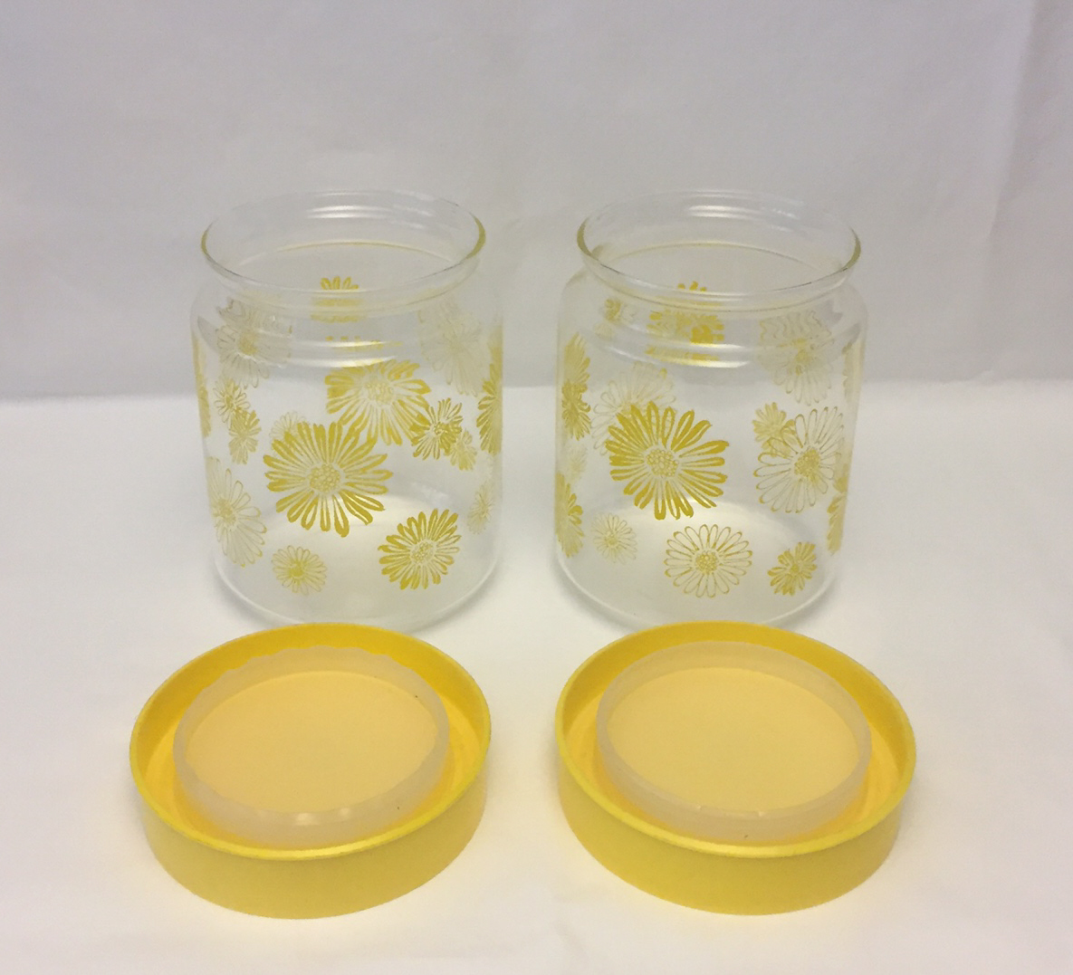 2 vintage Corning Glass kitchen canisters yellow daisy flowers plastic