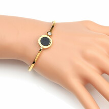 Gold Tone Bangle Bracelet With Faux Onyx & Swarovski Style Crystal - $26.99