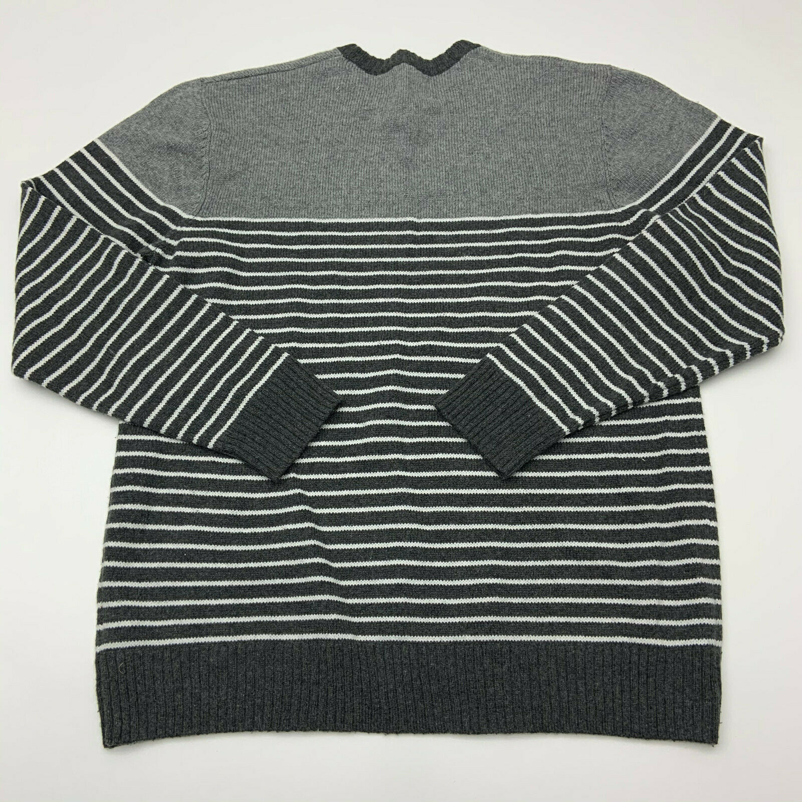 type of sweater made from thick undyed wool