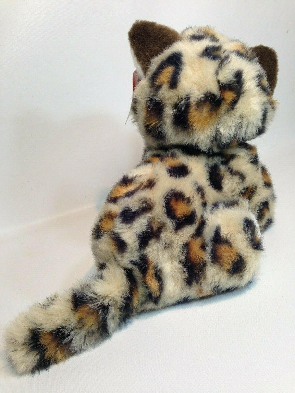 kitten with stuffed animal