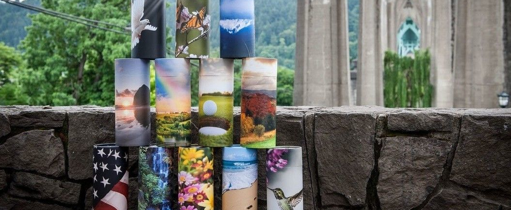 image of cylindrical urns with photos on them