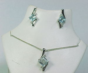 Genuine BLUE TOPAZ and DIAMOND NECKLACE and EARRINGS Set in Sterling Silver, an item from the 'December's Birthstone: Blue Topaz' hand-picked list