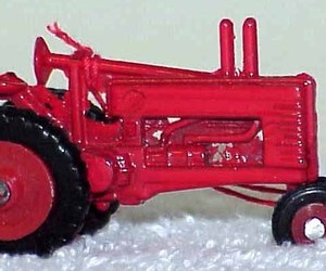Vintage Red Metal FARM TRACTOR Ornament NOS, an item from the 'Seeing Red' hand-picked list