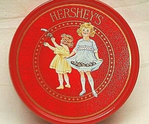 Hershey&#39;s Red Metal Tin Can Two Girls circa 1921 Advertising Ad, an item from the 'Seeing Red' hand-picked list