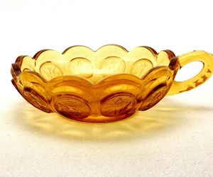 Fostoria Honey Amber Coin Glass Nappy Bowl, 5.25&quot;, Fluted, Handle, Scalloped Rim, an item from the 'Elegant Amber' hand-picked list