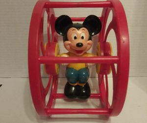 Walt Disney Productions Rolling Spinning Wheel Toy Mickey Mouse 1960&#39;s RED, an item from the 'Seeing Red' hand-picked list