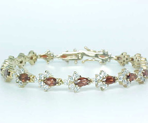 GARNET and CUBIC ZIRCONIA Vintage BRACELET in Gold on STERLING - 7.5 inches long, an item from the 'Garnets are January’s birthstone ' hand-picked list