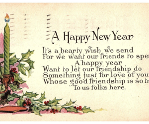 A Happy New Year candle surrounded by holly berry New Year Postcard Posted 1917, an item from the 'Happy New Year 2023 ' hand-picked list