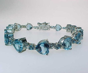 BLUE TOPAZ Large HEARTS Tennis BRACELET in STERLING Silver - 8 1/2 inches, an item from the 'December's Birthstone: Blue Topaz' hand-picked list