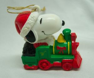 Peanuts Gang Santa SNOOPY Riding Train 2&quot; PLASTIC PVC CHRISTMAS ORNAMENT, an item from the 'Have A Merry and PEANUTTY Christmas' hand-picked list